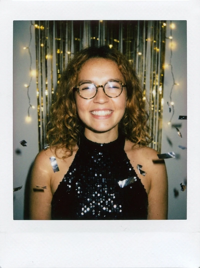 New Year polaroid on Nano Banana Pro: black sequin top, gold tinsel, silver confetti, white polaroid frame, AI-generated test image